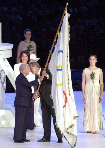[Ceremonial Olympic flag photo]